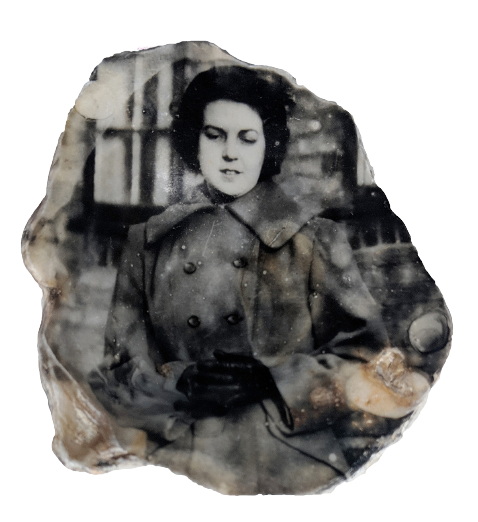 a photograph developed on a shell of a woman